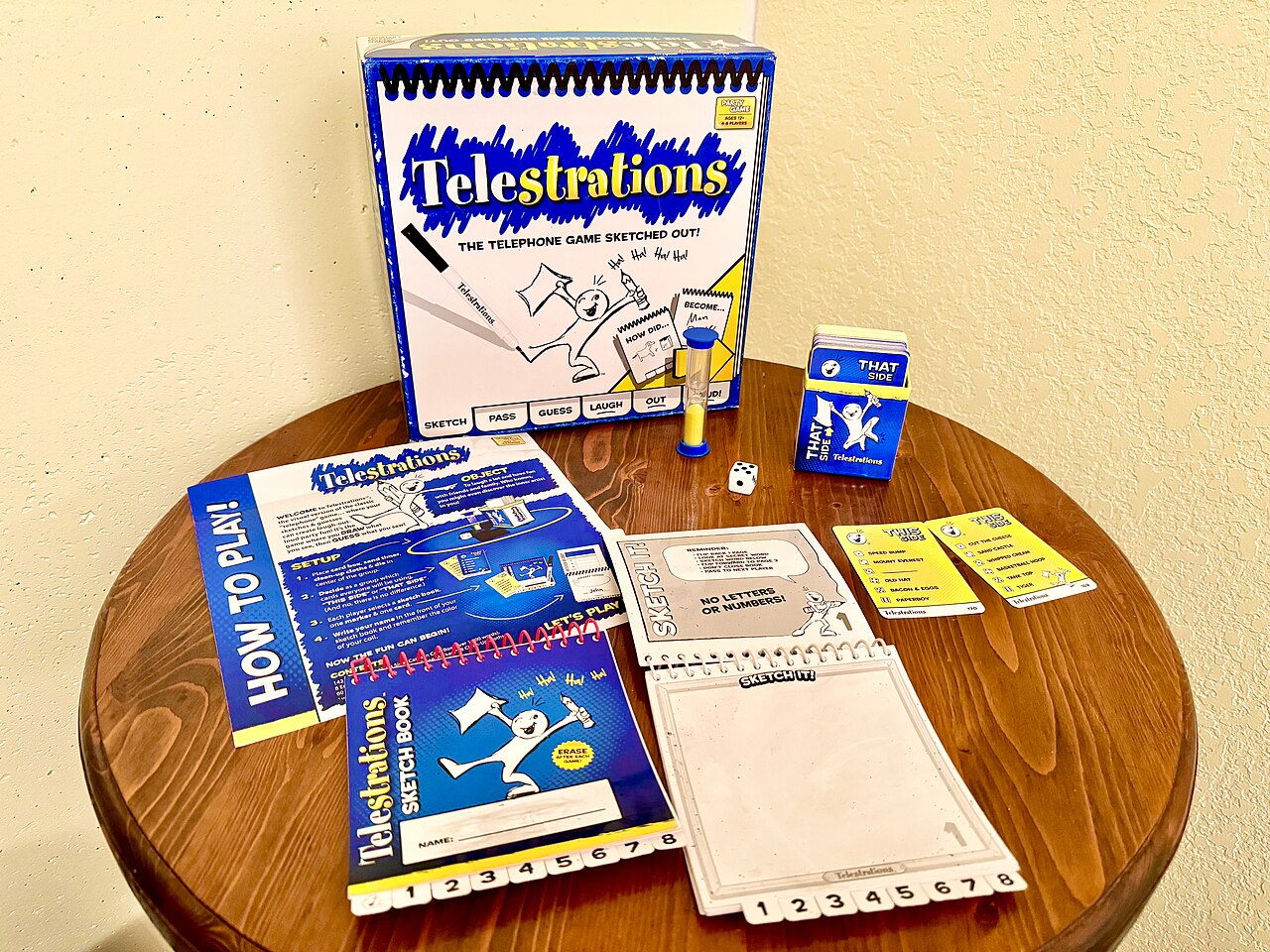 Telestrations party game of drawing and guessing