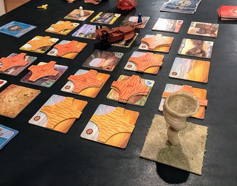 Forbidden Desert board game. Meeple's hiding from 3D printed storm