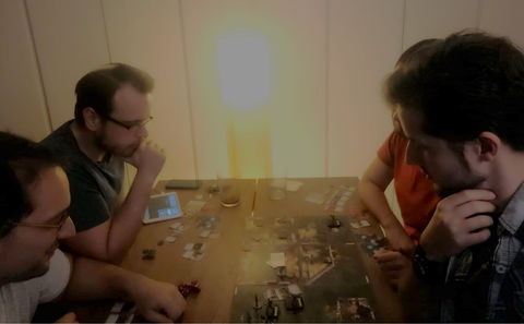 group of friends playing Mansions of Madness