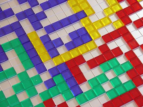 Close-up photograph of the board of the boardgame Blokus in play