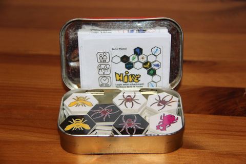 My own portable Hive set cut from PVC flooring. Fits into an Altoid sized tin!