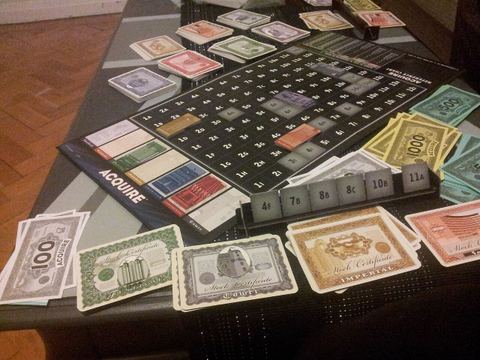 Aquire board game - 2008 (cheap) edition in play.
